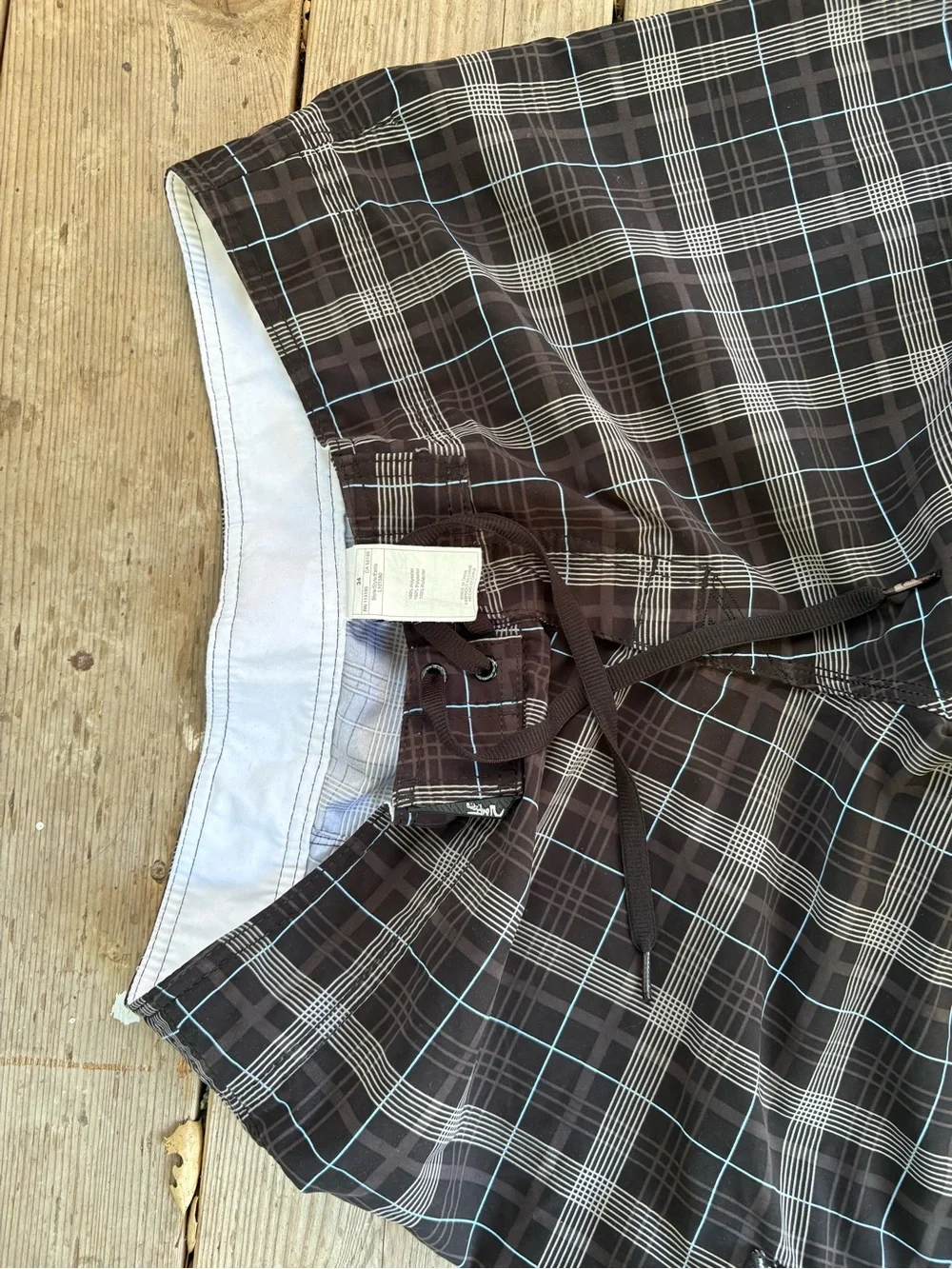Quiksilver grail Black & Gray Plaid Board shorts.